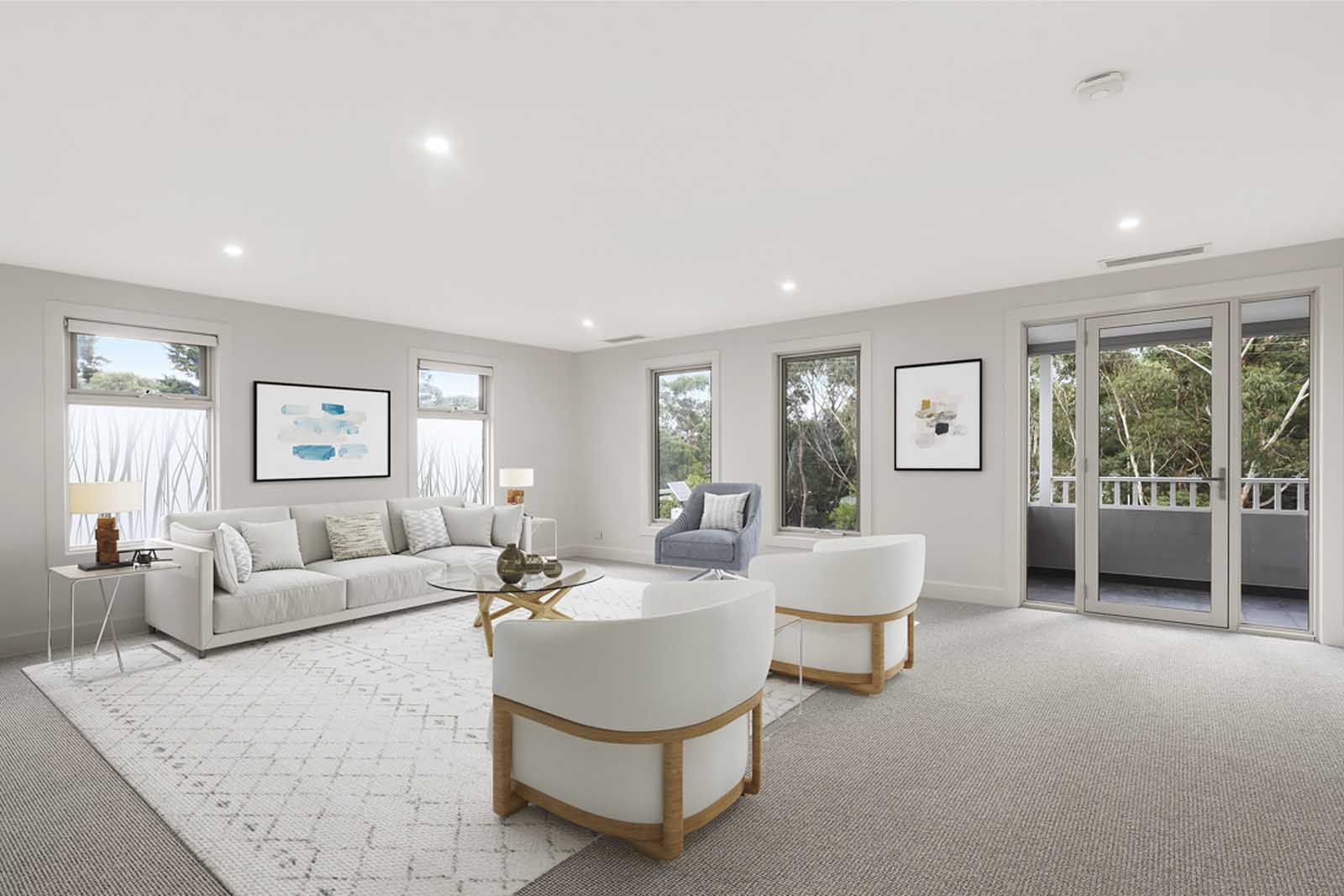 Living room with soft furnishings and garden windows
