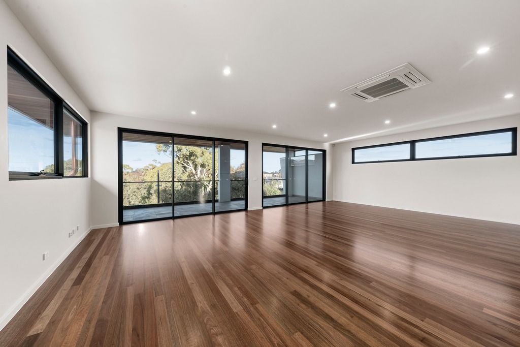 Upstairs living with wide windows