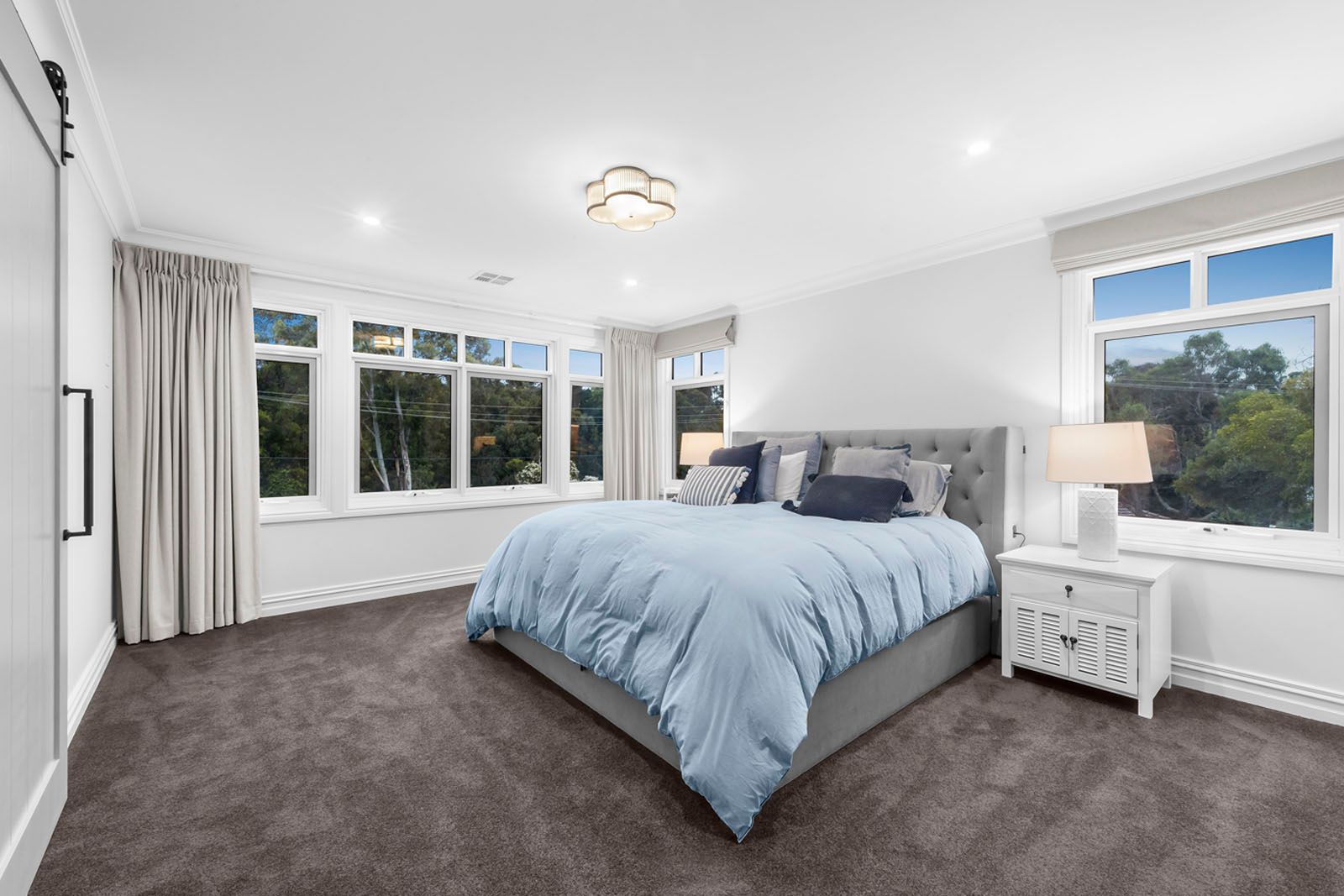Main bedroom with garden windows