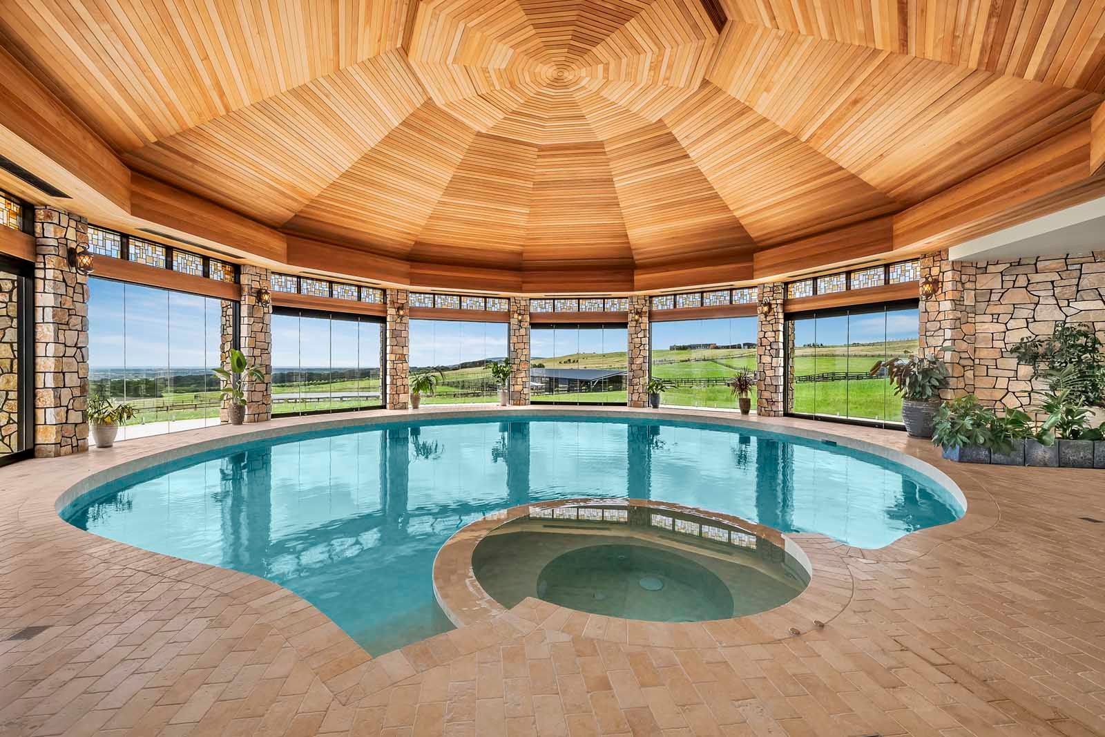 Indoor pool and spa under a 12-sided cedar ceiling