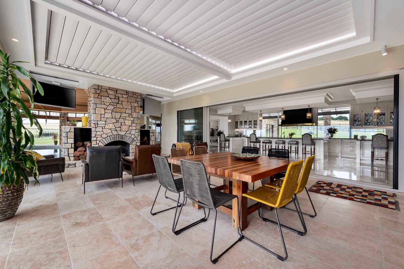 Dining and living under coffered ceilings