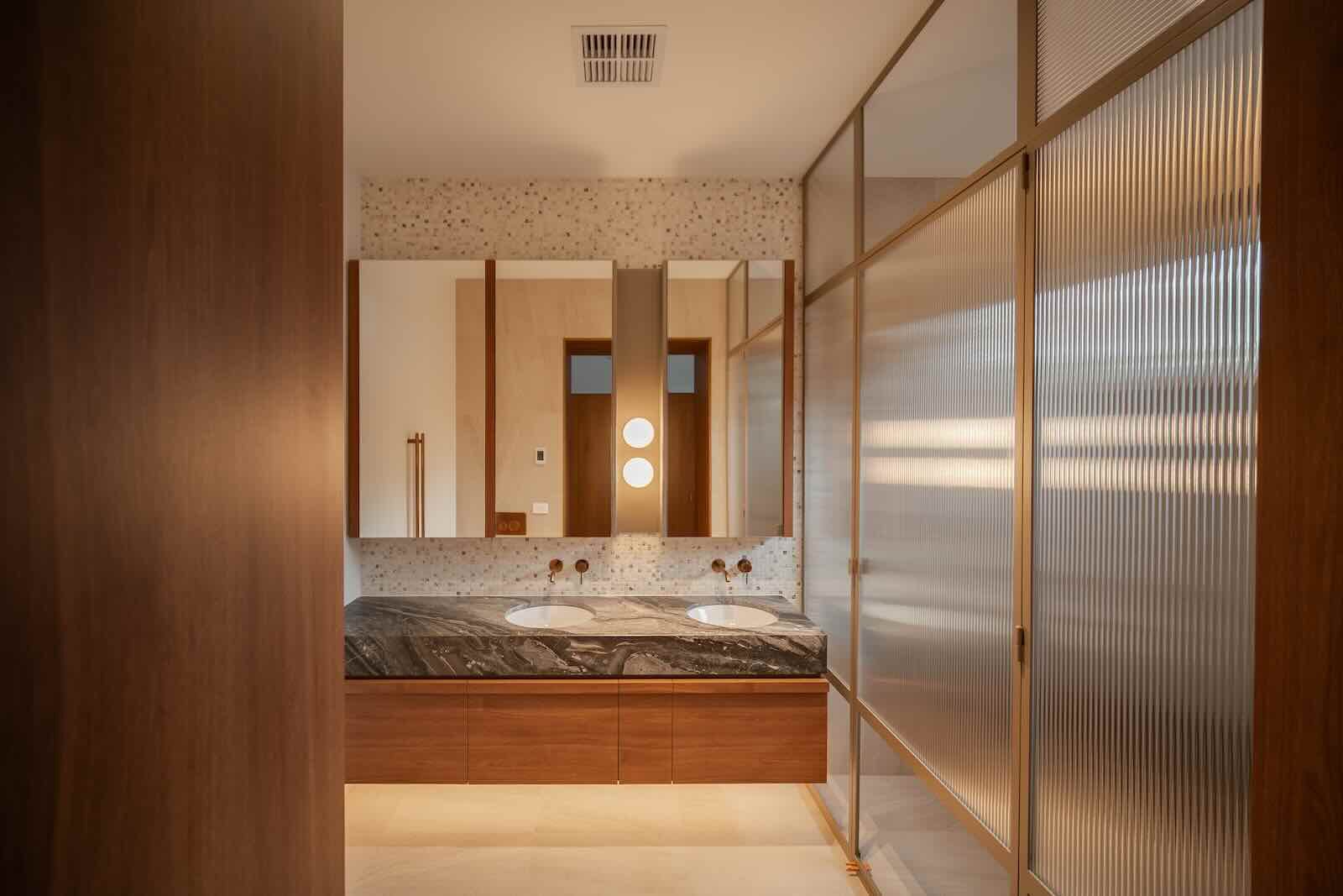 Ensuite with fluted glass screen and timber joinery