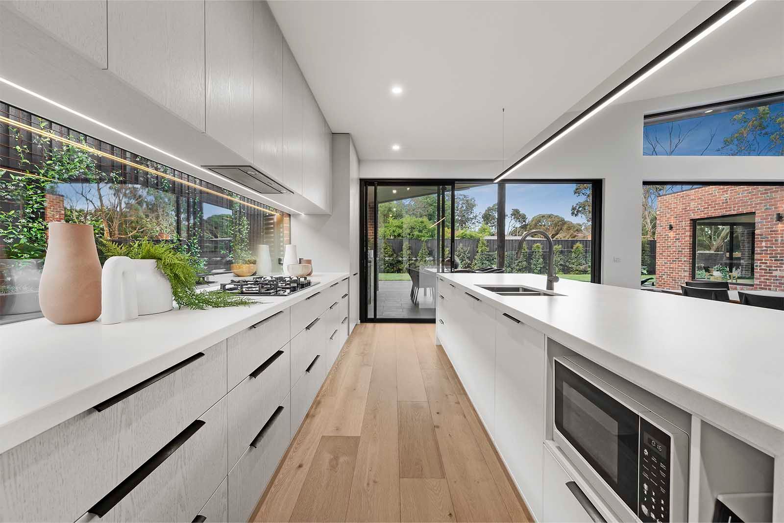 Kitchen with white joinery and timber floors