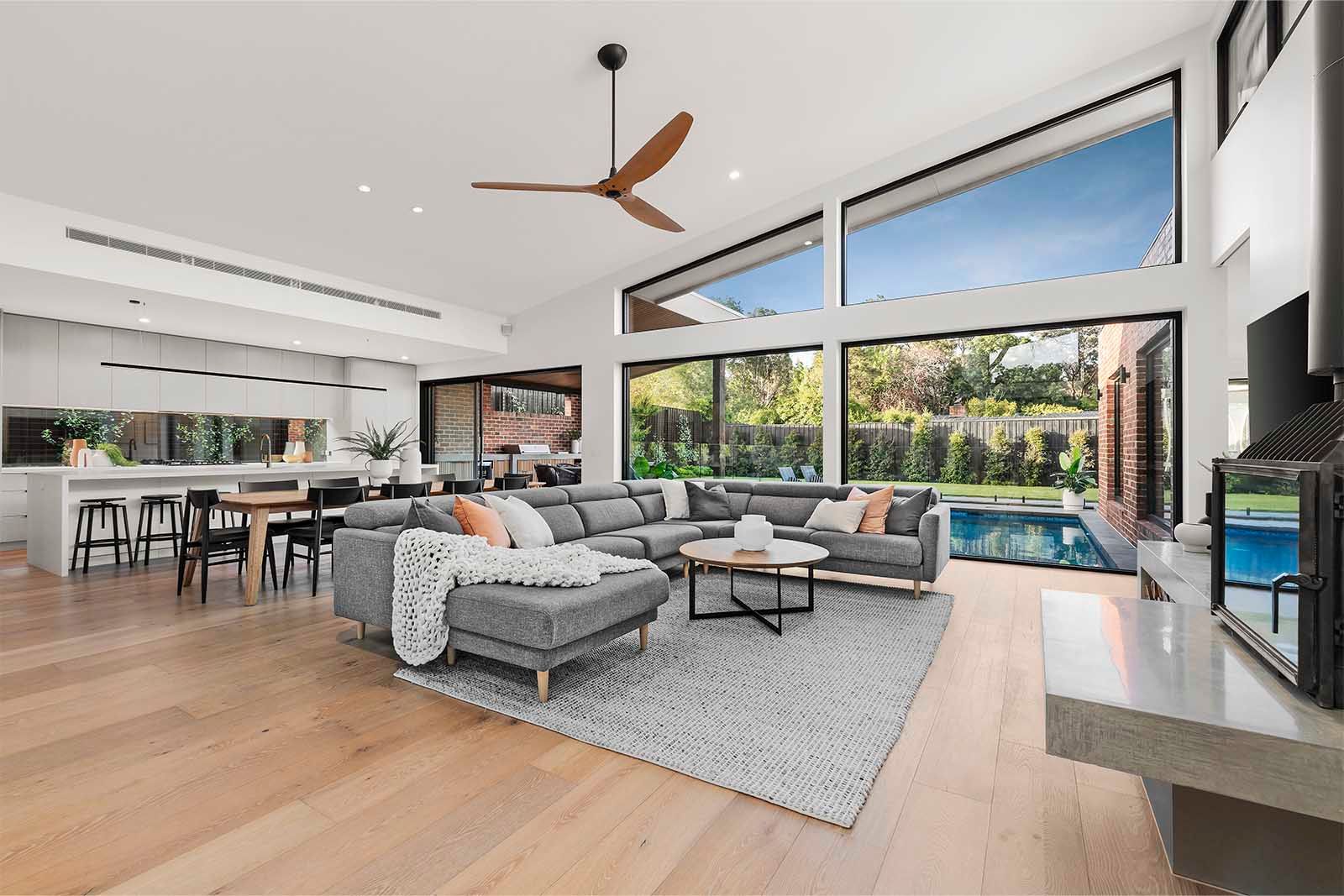 Living area looking out to the pool through full-height glass