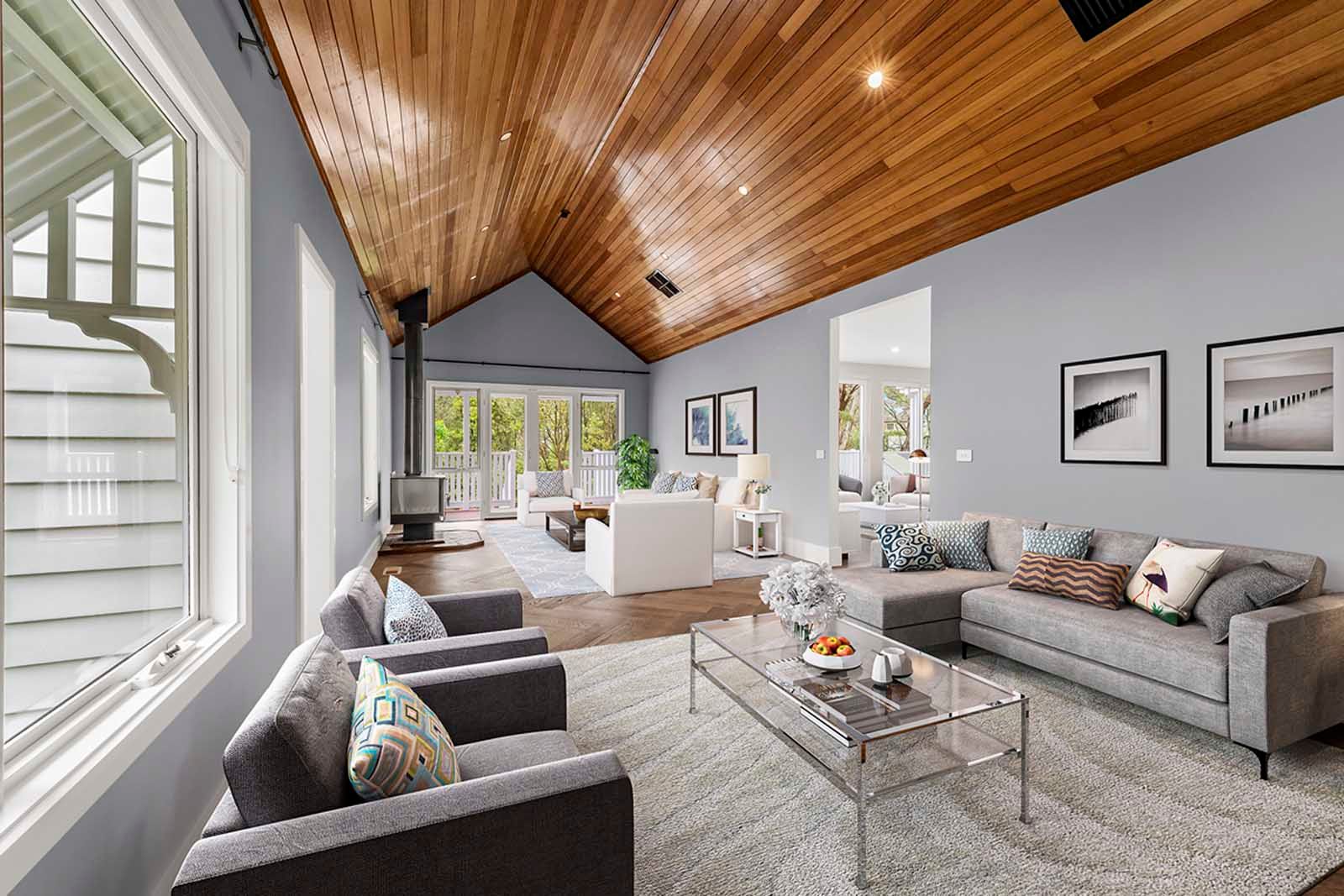 Living room under a timber-lined cathedral ceiling